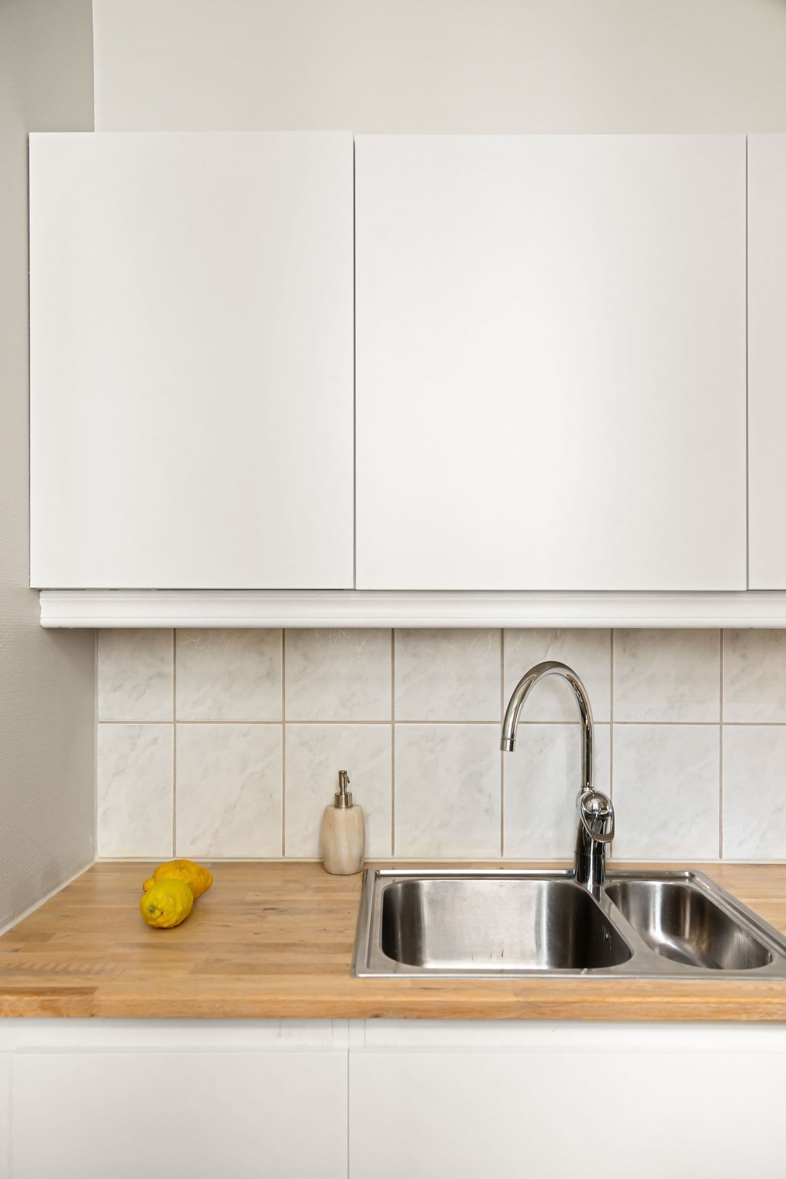 Modern kitchen sink prepped for holiday cooking — a common source of drain clogs